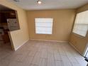 Bright dining room with tiled floor, adjacent to the kitchen area at 206 W 9Th St, Lakeland, FL 33805