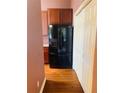 Modern refrigerator with water dispenser and cabinetry for easy meal preparation at 208 Shepard Ave, Dundee, FL 33838