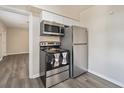 A kitchen showcasing stainless steel appliances including a range and refrigerator, and ample storage at 406 W Valencia St, Lakeland, FL 33805