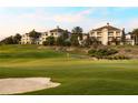 Picturesque golf course view with lush green fairways and manicured landscaping around luxury condominiums at 7673 Heritage Crossing Way # 202, Reunion, FL 34747