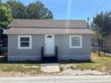 Charming single-story home with a gray exterior, white trim, and a well-maintained front yard at 400 Sw 1St Ave, Mulberry, FL 33860