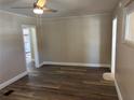 Inviting living room with wood-look flooring and a ceiling fan for added comfort at 400 Sw 1St Ave, Mulberry, FL 33860