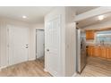 Inviting entryway with a light-colored wood floors and doors at 1313 Periwinkle Ct, Lakeland, FL 33811