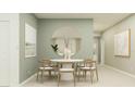 Contemporary dining room with a round table, seating for six, and a large mirror creating an inviting space at 2759 Pioneer Trl, Eagle Lake, FL 33839