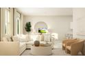 Inviting living room showcasing a plush sofa, modern decor, and ample natural light for a comfortable ambiance at 2633 Skyline Loop, Kissimmee, FL 34758