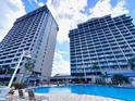 Resort pool area with water feature and lounge chairs at 13415 Blue Heron Beach Dr # 1006, Orlando, FL 32821