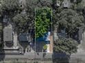 Overhead aerial view displays property boundaries with surrounding neighborhood and lush trees at 1205 Crestwood Dr, Winter Haven, FL 33881