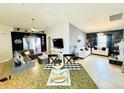 Spacious and stylish living area featuring modern decor, a ceiling fan and great natural light at 612 Chicago Way, Dundee, FL 33838