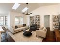 Bright living room with vaulted ceilings, skylights, and cozy furnishings at 1507 Wheeler Rd, Apopka, FL 32703