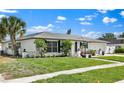 Attractive single-story home offering a manicured lawn, a convenient attached garage, and lush landscaping at 1913 Poinsetta Ln, Maitland, FL 32751