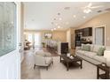 Open concept living room and kitchen featuring modern furnishings and neutral color palette at 1 Pecan Course Cir, Ocala, FL 34472