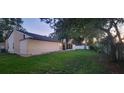 A spacious backyard with a screened porch, perfect for outdoor entertaining and enjoying the natural surroundings at 1524 New Jersey Oaks Ct, Lakeland, FL 33801