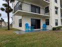 Exterior patio featuring outdoor seating and a sliding glass door for seamless indoor-outdoor living at 3100 Ocean Shore Blvd # 101, Ormond Beach, FL 32176