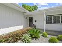 Close up of a charming front door and well-maintained landscaping. House number 1105 at 1105 Chichester St, Orlando, FL 32803