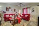Comfortable living room with vaulted ceiling, plush seating, and stylish decor at 56 Pine Trak # 101E, Ocala, FL 34472
