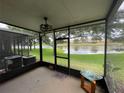 Relax in the screened lanai with a ceiling fan and enjoy serene lake views and a peaceful environment at 6059 Twain St # 108, Orlando, FL 32835