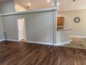 View of the living space highlighting the new floors and kitchen at 1608 Fox Glen Ct, Winter Springs, FL 32708