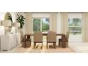 Dining room featuring a modern wood table and chairs with natural light from large windows at 2115 Forage Dr, Kissimmee, FL 34746