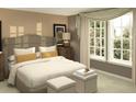 Comfortable bedroom with a large window, neutral tones, and soft lighting, creating a relaxing atmosphere at 2433 Spring Tune Aly, Kissimmee, FL 34744