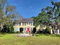 Charming two-story home with a red door at 800 W Lake Elbert Ne Dr, Winter Haven, FL 33881