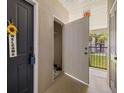 Hallway entrance featuring a storage closet, neutral paint, and a view of the outdoors at 4014 Hemingway Cir # 4014, Haines City, FL 33844