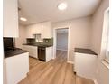 Modern kitchen featuring white cabinets, stainless steel appliances, and modern countertops at 2201 Flamingo Ave, Deltona, FL 32738
