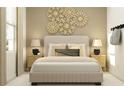 Beautifully decorated bedroom with stylish wall art, soft bedding, and contemporary lamps at 1169 Hour Glass Rd, Lakeland, FL 33801