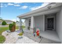 Inviting front porch with decorative accents and a welcoming entrance to the home at 305 St Georges Cir, Eagle Lake, FL 33839