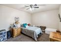 Cozy bedroom with neutral walls, ceiling fan, and comfortable furnishings creates a relaxing space at 7759 Sugar Bend Dr # 7759, Orlando, FL 32819