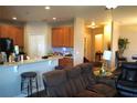 Open-concept living space with updated kitchen featuring bar seating, and living room combo at 1886 Van Gogh Dr, Auburndale, FL 33823