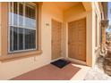 Front porch with two entry doors and a window at 140 Napoli Dr, Davenport, FL 33897