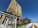A multi-story building with views of the ocean and a well-manicured lawn at 2300 N Atlantic Ave # 1502, Daytona Beach, FL 32118
