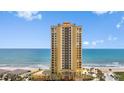 Stunning exterior shot of a high-rise building with direct ocean views and beach access at 2300 N Atlantic Ave # 1502, Daytona Beach, FL 32118