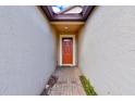 Covered entryway leading to a striking front door, offering privacy and protection at 518 Cortez Dr, Davenport, FL 33837