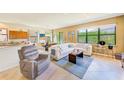 Open living room featuring a large sofa, natural light, and comfortable seating at 518 Cortez Dr, Davenport, FL 33837