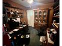 Bedroom features wood paneling, shelves, display cabinet, and desk area at 606 El Vedado Ave, Orlando, FL 32807