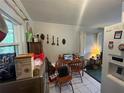 Bright dining area with tile floors, wood table set and natural light at 606 El Vedado Ave, Orlando, FL 32807