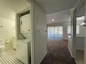 View of the living room and laundry area with washer and dryer at 568 Bahia Cir # B, Ocala, FL 34472