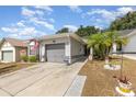 Charming single-story home featuring a well-maintained yard and a two-car attached garage at 640 Lake Dexter Cir, Winter Haven, FL 33884