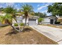 Charming single-story home featuring a well-maintained yard and a two-car attached garage at 640 Lake Dexter Cir, Winter Haven, FL 33884