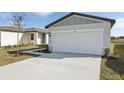 The house features a two-car garage and a freshly landscaped front yard at 2530 Linda Knoll Ln, Bartow, FL 33830