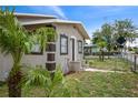 This cozy home has a well-maintained lawn with a small palm tree out front at 1101 Dr Martin L King Jr Way, Haines City, FL 33844