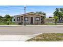 Charming home featuring a cozy front porch, meticulous landscaping, and a classic lamp post at 1101 Dr Martin L King Jr Way, Haines City, FL 33844