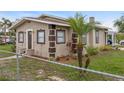 This home features meticulous landscaping with a nice palm tree in the front yard at 1101 Dr Martin L King Jr Way, Haines City, FL 33844