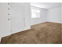 Bright living room with a window, carpet and fresh white walls at 2425 Anderson, Mulberry, FL 33860