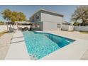 Backyard with a sparkling pool and an outdoor seating area, perfect for entertaining guests at 1808 Ashton E Dr, St Cloud, FL 34771