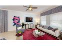 Comfortable living room with plush seating, a vibrant rug, and plenty of natural light at 1888 Bright Sky Dr, Kissimmee, FL 34744