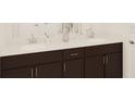Bathroom vanity with double sinks, dark wood cabinets, and light countertops at 2437 Spring Tune Aly, Kissimmee, FL 34744