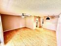 Spacious living room featuring wood floors, a ceiling fan, and neutral wall paint at 296 Lewfield Cir, Winter Park, FL 32792