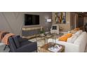 Comfortable living room with modern furniture, neutral tones, and stylish decor at 4723 Golden Knight Blvd, Kissimmee, FL 34746